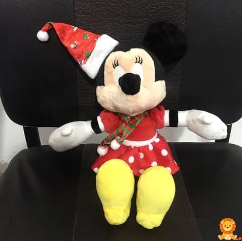 Christmas Minnie Mouse plush wearing a festive holiday outfit with a red and green dress and a Santa hat, holding a candy cane, perfect for holiday decorations and gifts. - View 2