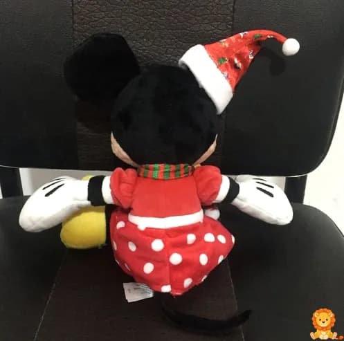 Christmas Minnie Mouse plush wearing a festive holiday outfit with a red and green dress and a Santa hat, holding a candy cane, perfect for holiday decorations and gifts. - View 4