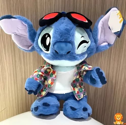 ตุ๊กตา Stitch สีฟ้าสดใส สวมเสื้อเชิ้ตลายดอกไม้หลากสีสัน น่ารัก น่ากอด เหมาะสำหรับเป็นเพื่อนเล่นและของสะสม - View 2
